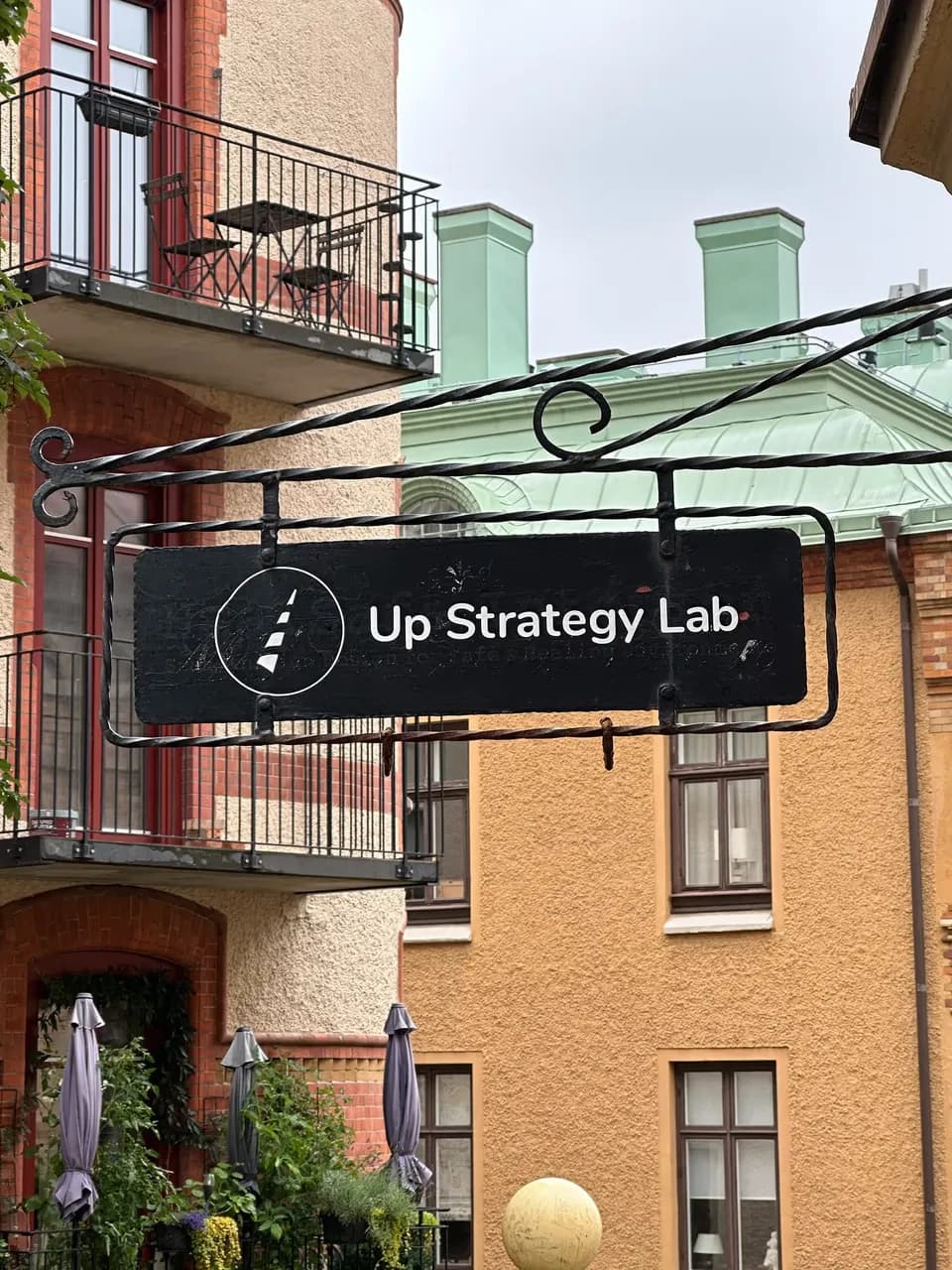 The Up Strategy Lab sign outside the studio in Gothenburg, Sweden