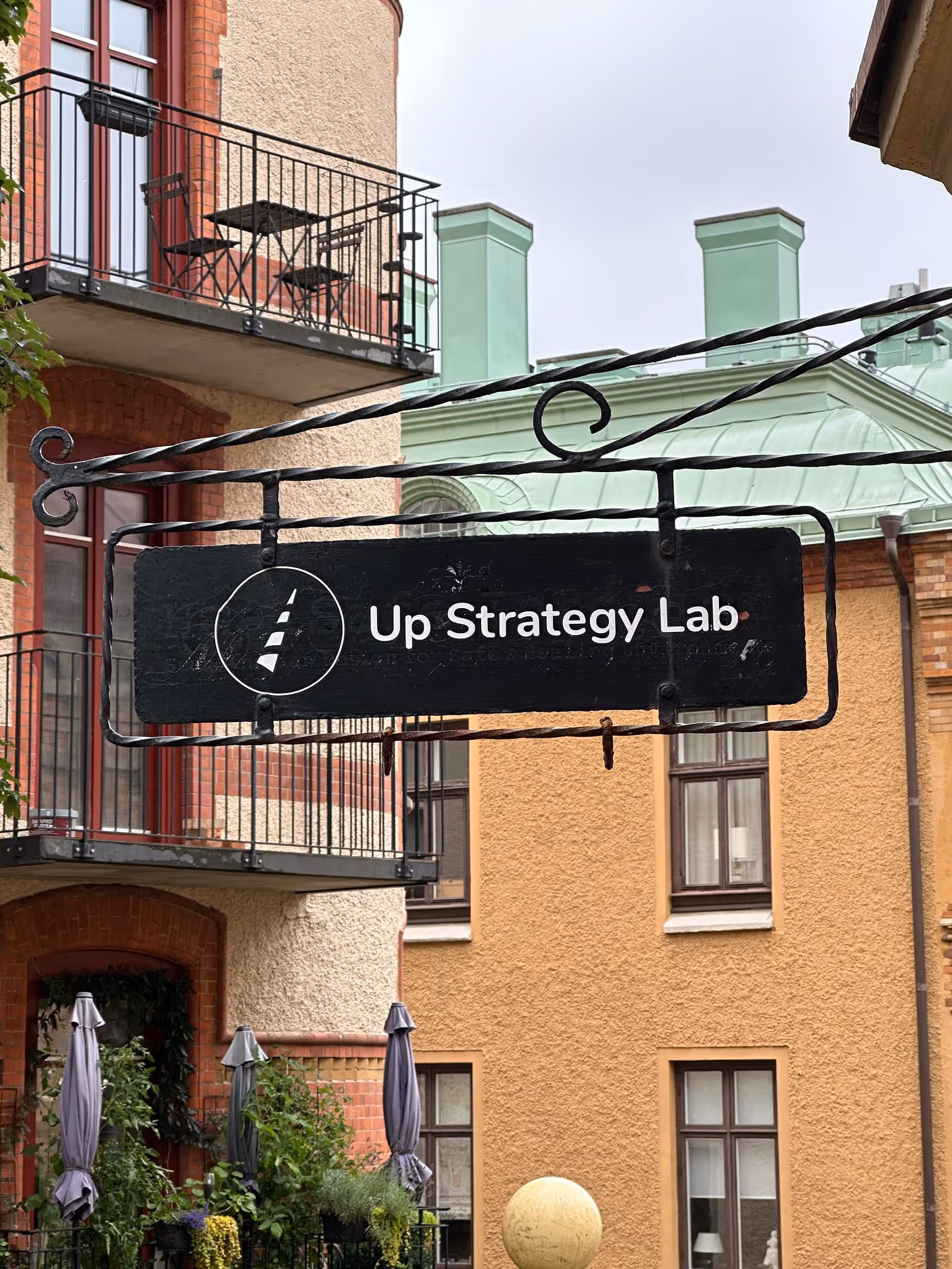 The Up Strategy Lab sign outside the studio in Gothenburg, Sweden